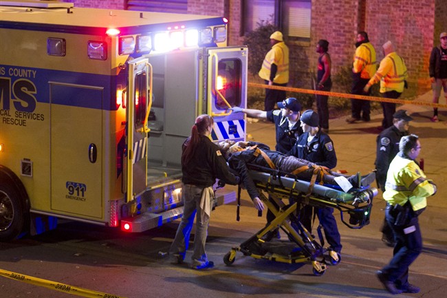 A man is transported to an ambulance after being struck by a vehicle on Red River Street in downtown Austin, Texas, during SXSW on Wednesday March 12, 2014.