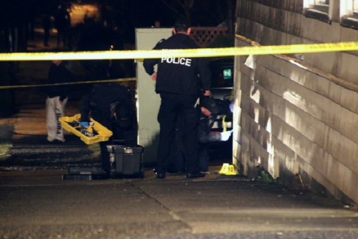 Police investigate a shooting in East Vancouver on March 9, 2014.