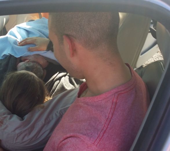 Robyn and Brook Tyler in their car after the birth of their new daughter Rosalie, April 8, 2014