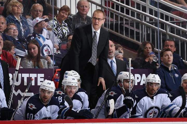 Head coach Paul Maurice of the Winnipeg Jets stands up on the bench after a penalty call during an April 1 game in Glendale, Ariz.