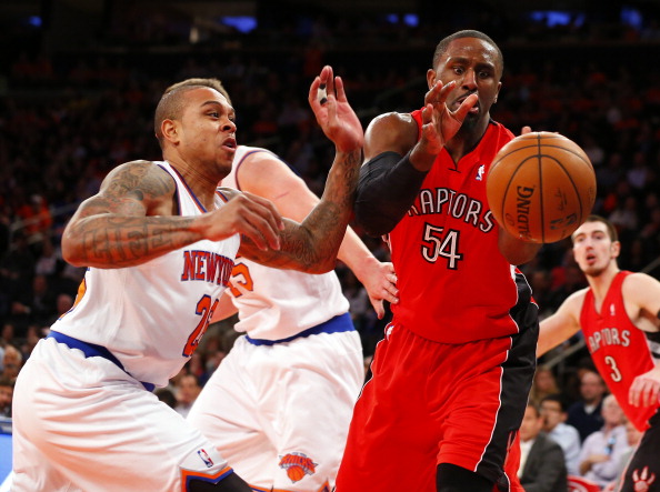 Shannon Brown #26 of the New York Knicks and Patrick Patterson #54 of the Toronto Raptors fight for a loose ball in the second half during an NBA basketball game at Madison Square Garden on April. 16, 2014 in New York City. (Photo by Rich Schultz /Getty Images).
