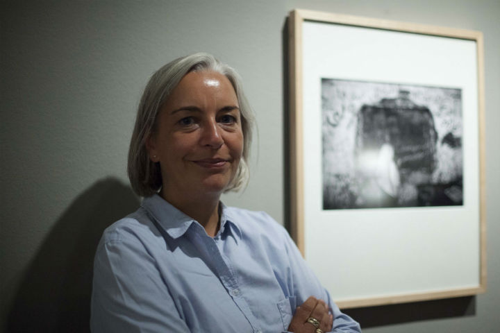 Anja Niedringhaus poses as she attends an exhibition of her work in Berlin on Sept. 11, 2011. Niedringhaus, 48, was killed and an AP reporter was wounded on Friday, April 4, 2014 when an Afghan policeman opened fire while they were sitting in their car in eastern Afghanistan. Niedringhaus an internationally acclaimed German photographer, was killed instantly, according to an AP Television freelancer who witnessed the shooting.