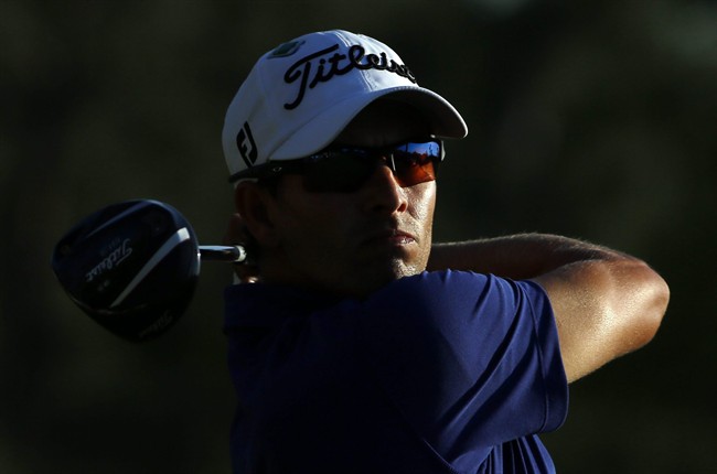 Adam Scott, of Australia, tees off during the third round of the Masters golf tournament Saturday, April 12, 2014, in Augusta, Ga.