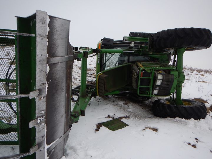 Alberta Mounties had to bum a ride with a snowmobiler to chase a stolen tractor through snowy fields east of Red Deer.
