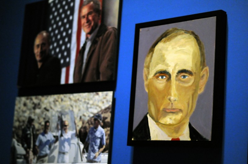 A portrait of Russian President Vladimir Putin which is part of the exhibit "The Art of Leadership: A President's Diplomacy," are on display at the George W. Bush Presidential Library and Museum in Dallas, Friday, April 4, 2014. (AP Photo/Benny Snyder).
