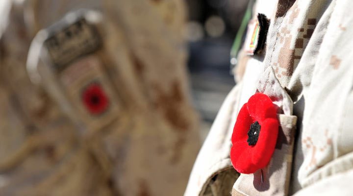 A poppy is pinned on a Canadian Armed Forces soldier’s uniform at the final Remembrance Day ceremony held by Canadian soldiers in Afghanistan on November 11, 2013.