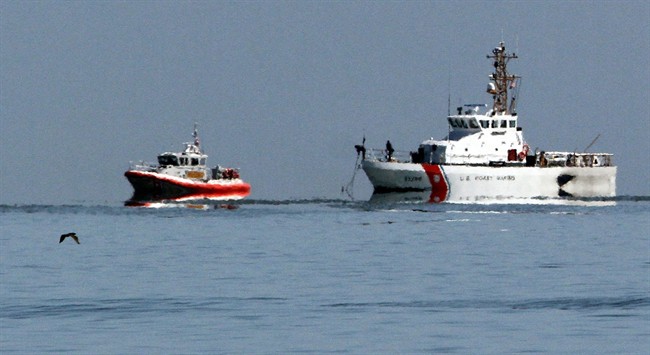 Coast Guard vessels search the waters of San Pablo Bay on Monday, April 28, 2014, in Richmond, Calif. 