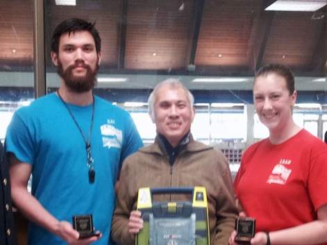 Lifeguards Kai Favrholdt and Leah Wait with cardiac arrest survivor Simon Tsang.