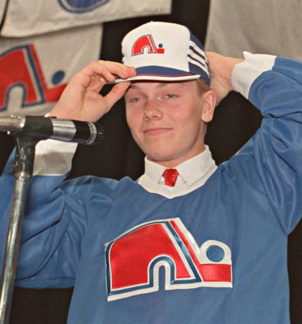 Mats Sundin tries on a Quebec Nordiques cap after being picked first overall in the NHL entry draft in Minneapolis, Minn., June 17, 1989. The Conference Board of Canada says the economic conditions are favourable enough to have three more National Hockey League franchises in the country within the next 20 years. THE CANADIAN PRESS/Jacques Boissinot.