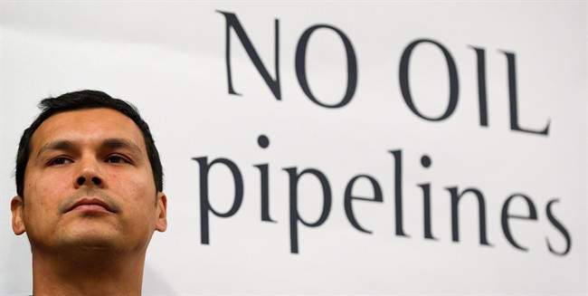Actor Adam Beach looks on during a signing ceremony for a declaration opposing a crude oil pipeline and tanker expansion in Vancouver, B.C., on Thursday December 1, 2011. THE CANADIAN PRESS/Darryl Dyck