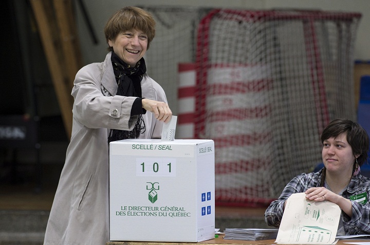 Quebec Solidaire spokesperson Francoise David drops her ballot in the ballot box Monday, April 7, 2014 in Montreal.