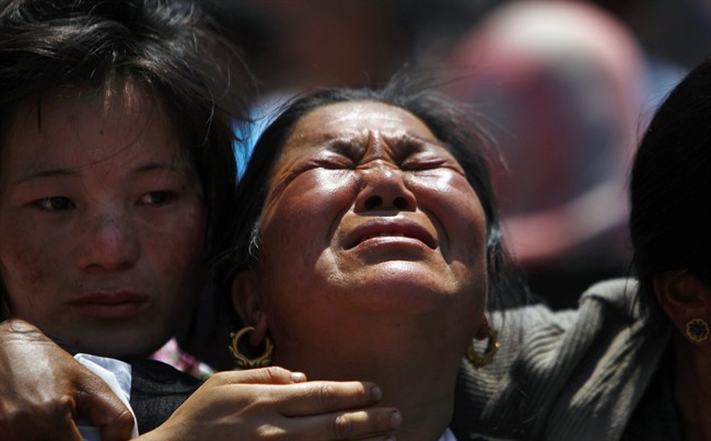 Relatives of mountaineers, killed in an avalanche on Mount Everest, cry during the funeral ceremony in Katmandu, Nepal, Monday, April 21, 2014. 