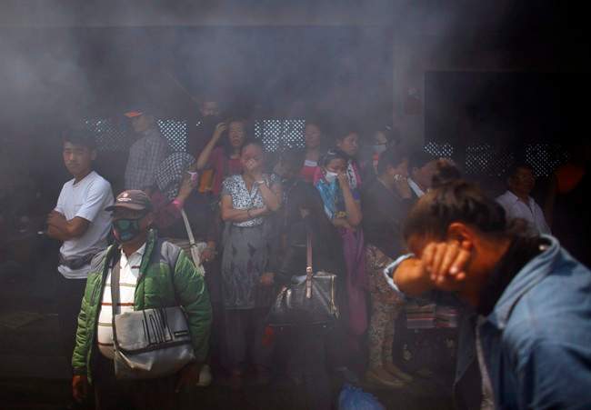 Smoke rises from the cremation pyre of mountaineers, killed in an avalanche on Mount Everest, during a funeral ceremony in Katmandu, Nepal, Monday, April 21, 2014. 