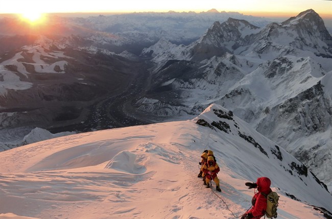 In this May 18, 2013 File Photo released by mountain guide Adrian Ballinger of Alpenglow Expeditions, hikers to the summit of Mount Everest, in the Khumbu region of the Nepal Himalayas.
