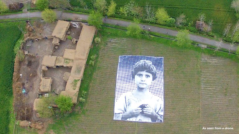 A group of Pakistani artists' have installed a giant poster of a victim of a drone attack in the Khyber Pakhtunkhwa region of Pakistan. 
