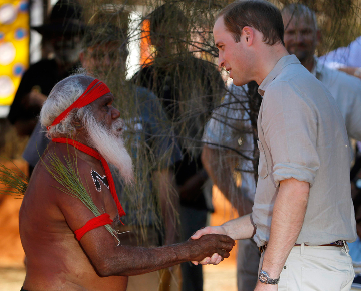 William talks with an Aboriginal man.