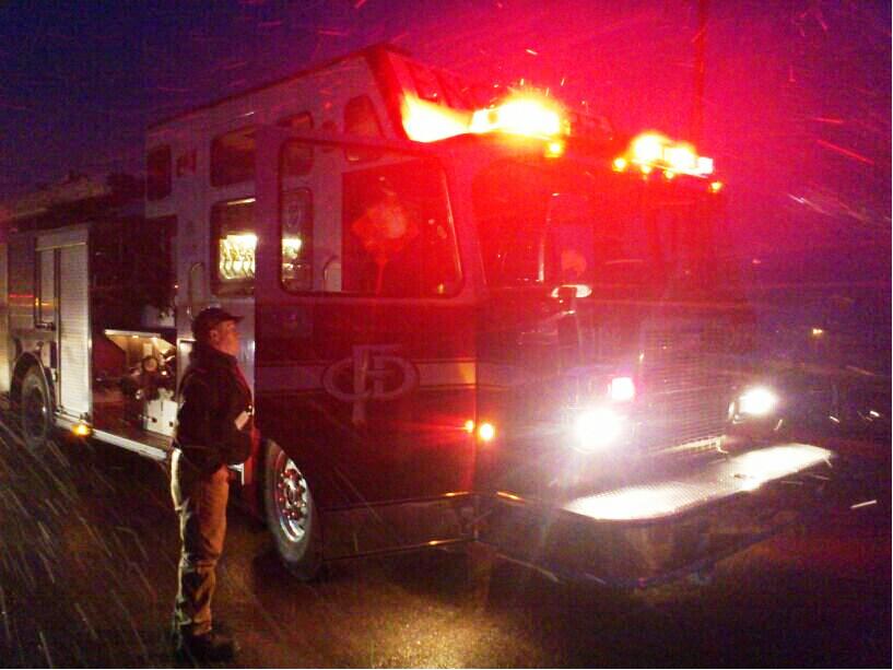 Enmax crews join the Calgary Fire Department on scene at a power pole fire along Coach Hill Road S.W. on Wednesday, April 09, 2014.