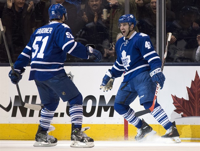 Toronto Maple Leafs centre Nazem Kadri (right) celebrates his game winning overtime goal with teammate Jake Gardiner against the Boston Bruins in NHL action in Toronto on Thursday April 3, 2014. 