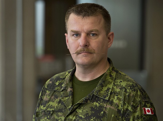 Maj. Marcus Brauer is seen in Halifax on Friday, April 11, 2014. Brauer will be in federal court in Halifax on Tuesday, seeking a judicial review of a decision by the Treasury Board Secretariat as he tries to recover thousands of dollars from the federal government he says was lost when he was posted to another city and had to sell his house at a loss. THE CANADIAN PRESS/Andrew Vaughan.