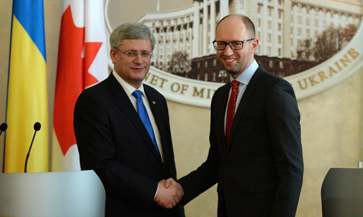 Prime Minister Stephen Harper shakes hands with Ukrainian Prime Minister Areseniy Yatsenyuk following a joint press conference at the Cabinet of Ministers in Kiev, Ukraine, on Saturday, March 22, 2014.