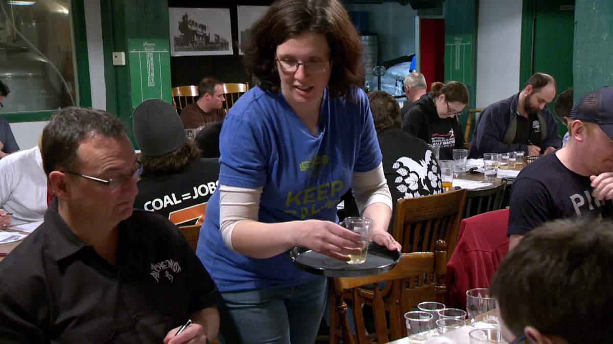 Beer samples are handed out for judging Saturday afternoon in the basement of the Bushwakker Brewpub.