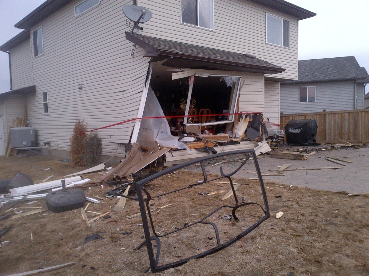 Damage to the home the vehicle hit.