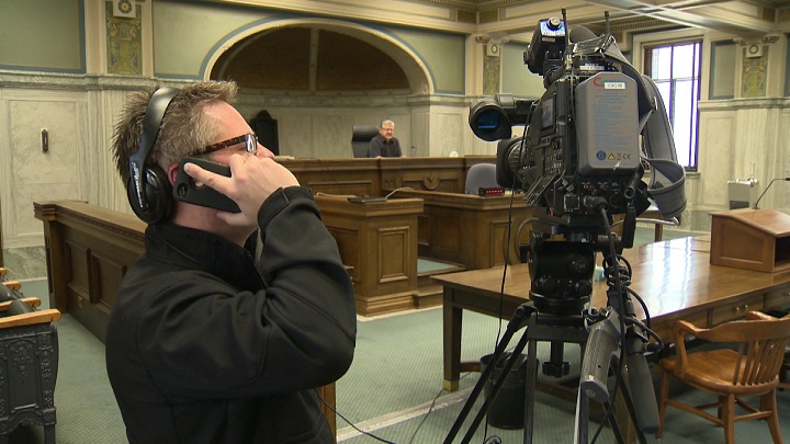 A camera operator tests out the signal from a camera set up to record a verdict in a murder trial in Winnipeg.