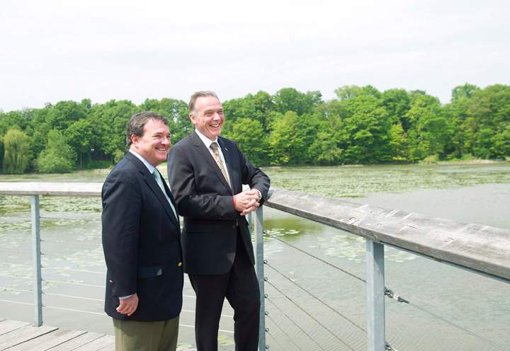 Jim Flaherty and Peter Kent take part in a photo opportunity after making an announcement regarding funding towards the Rouge National Urban Park in Scarborough, Ont., on Friday, May 25, 2012. 