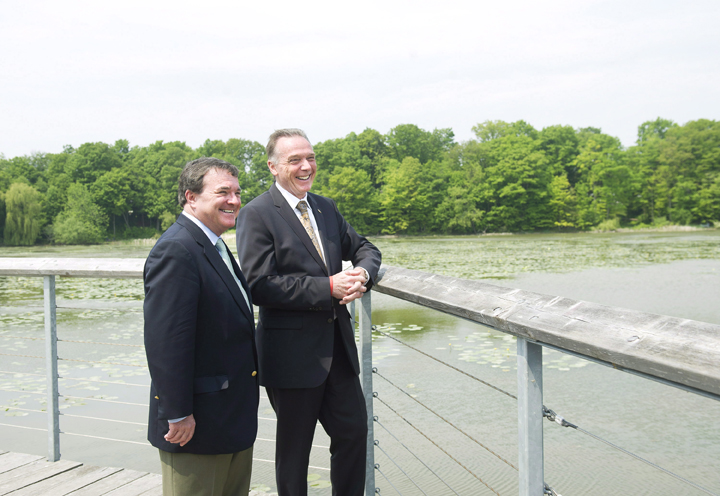 Jim Flaherty and Peter Kent take part in a photo opportunity after making an announcement regarding funding towards the Rouge National Urban Park in Scarborough, Ont., on Friday, May 25, 2012. 