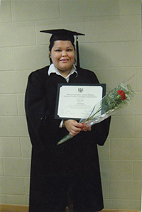 Kinew James with her high school diploma.