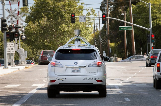 This Wednesday, April 23, 2014 photo provided by Google shows the Google driverless car navigating along a street in Mountain View, Calif. 