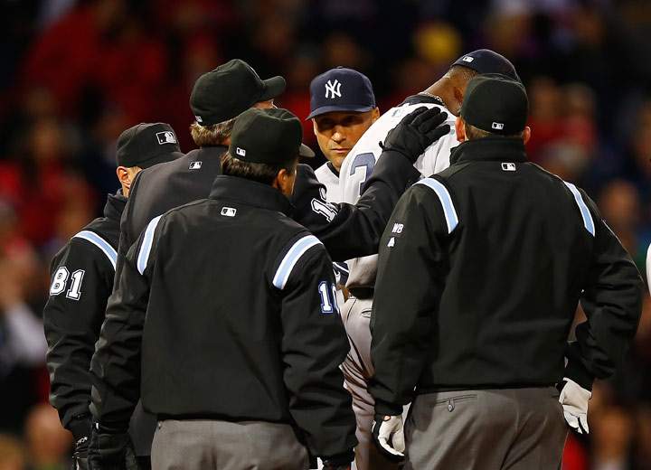 Home plate umpire Gerry Davis checks out a substance on the neck of Michael Pineda of the New York Yankees before throwing him out of the game in the second inning against the Boston Red Sox during the game at Fenway Park on April 23, 2014 in Boston, Massachusetts.  