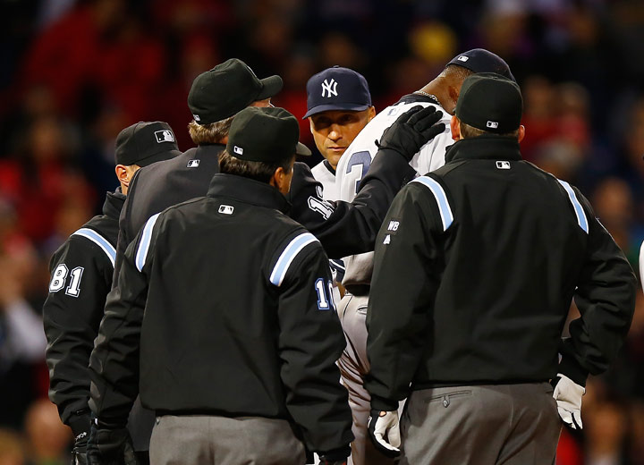 Home plate umpire Gerry Davis checks out a substance on the neck of Michael Pineda of the New York Yankees before throwing him out of the game in the second inning against the Boston Red Sox during the game at Fenway Park on April 23, 2014 in Boston, Massachusetts.  