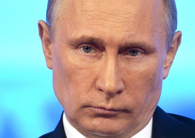 Russian President Vladimir Putin takes part in a televised call-in show with the nation in Moscow, Thursday, April 17, 2014. 