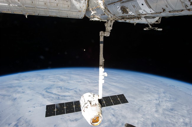 This file photo shows the release of the SpaceX Dragon-2 spacecraft from the International Space Station. NASA is pressing ahead with the planned launch of a supply ship despite a critical computer outage at the ISS.
