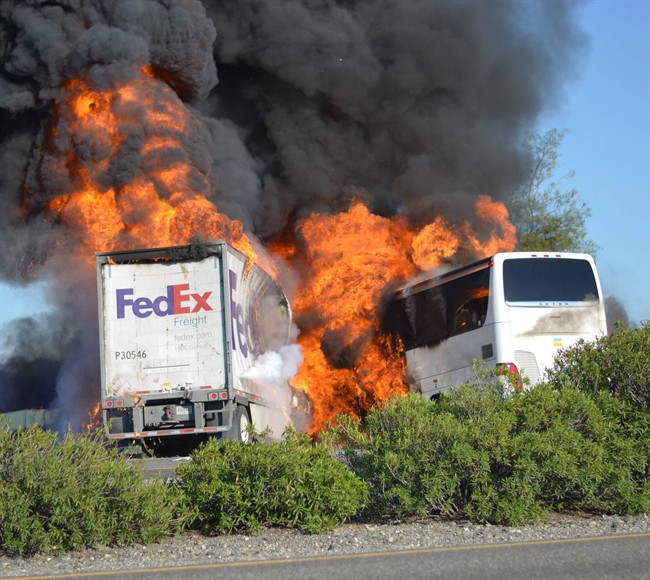 Massive flames are seen devouring both vehicles just after the crash, and clouds of smoke billowed into the sky Thursday April 10, 2014 until firefighters had quenched the fire, leaving behind scorched black hulks of metal. 