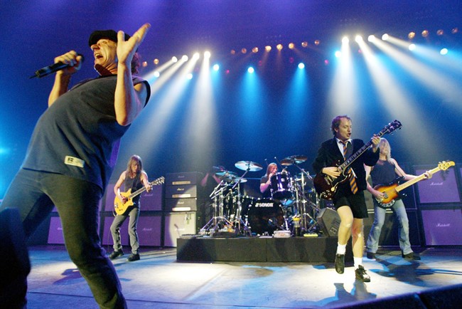 This June 17, 2003 file photo shows British rock band AC/DC, from left, Brian Johnson, Malcolm Young, Phil Rudd, Angus Young, and Cliff Williams performing on stage during a concert in Munich, southern Germany. 