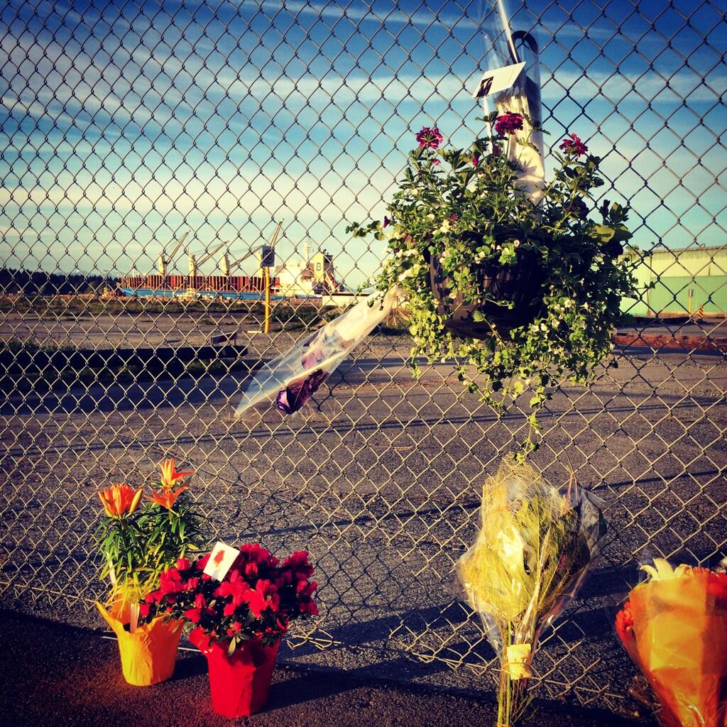 A growing memorial outside the gate of the Western Forest Products in Nanaimo.