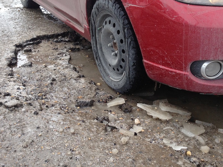 Winnipeg pothole pot hole streets asphalt roads CAA MPI