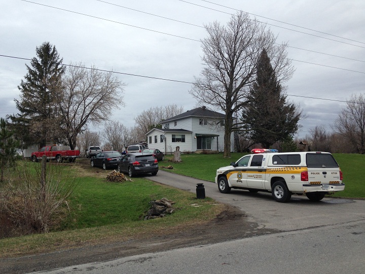 Quebec police conducting a search during raids on an illegal tobacco ring in Dundee, Que. on April 30, 2014.
