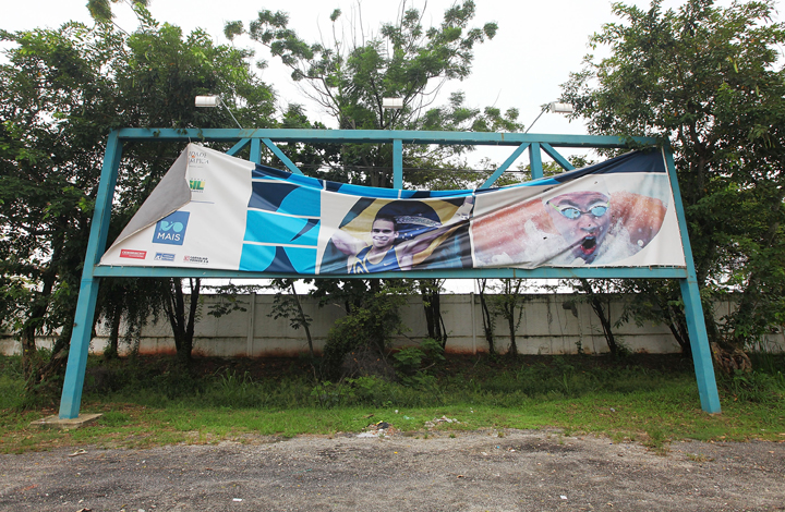 A sign advertising the Olympics stands near the entrance to Olympic Park, the primary set of venues being built for the Rio 2016 Olympic Games, on April 16, 2014 in Rio de Janeiro, Brazil.