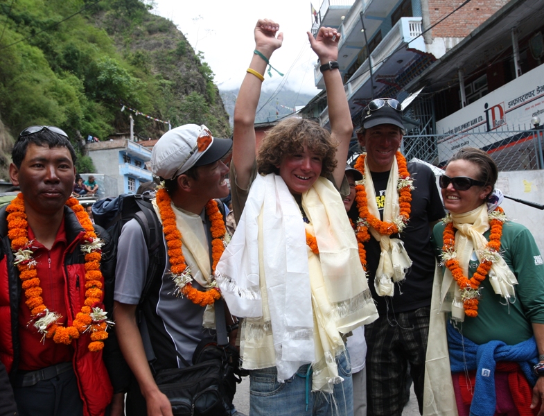 US teenager Jordan Romero (C) gestures as he arrives with supporters and family members at The Nepal-China border in the village of the Liping. AFP PHOTO/Prakash MATHEMA