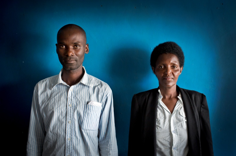 In this photo taken Wednesday, March 26, 2014, Emmanuel Ndayisaba, left, and Alice Mukarurinda, pose for a photograph at Alice's house in Nyamata, Rwanda. She lost her baby daughter and her right hand to a manic killing spree. He wielded the machete that took both. (Ben Curtis/AP Photo).