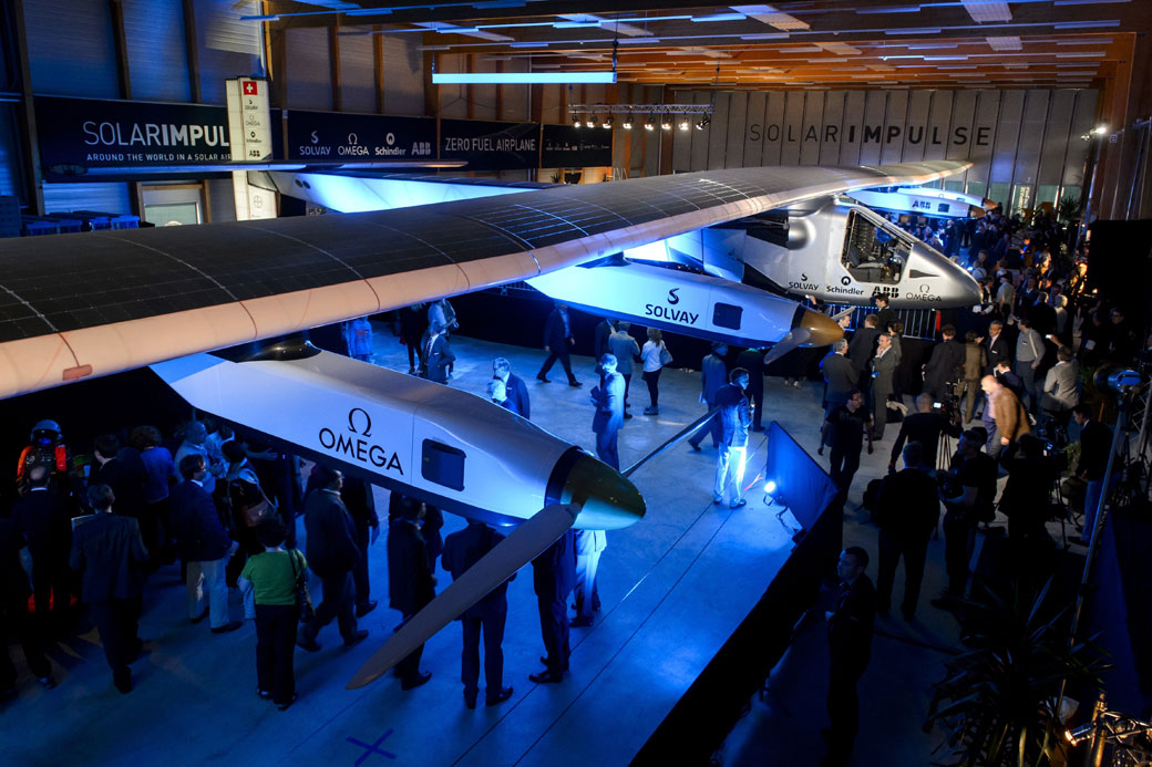 People look at the second Solar Impulse experimental solar-powered plane, the HB-SIB, to be used for a round-the-world voyage next year, during its presentation in Payerne on April 9.