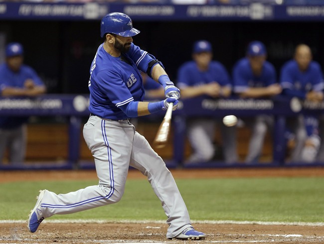 Toronto Blue Jays' Jose Bautista connects for a seventh-inning home run off Tampa Bay Rays relief pitcher Josh Lueke during a baseball game Wednesday, April 2, 2014, in St. Petersburg, Fla. Bautista also hit a home run in the fourth inning. (AP Photo/Chris O'Meara).