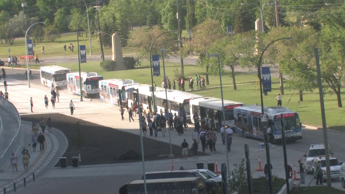 Buses and football fans lined up at the University of Manitoba during the first game at Investors Group Field on June 27, 2014.