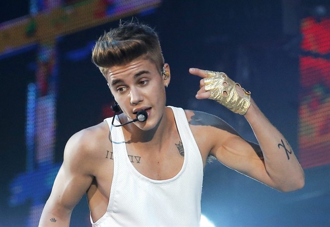 In this March 19, 2013 file photo, Justin Bieber performs during a concert at Bercy Arena in Paris. 