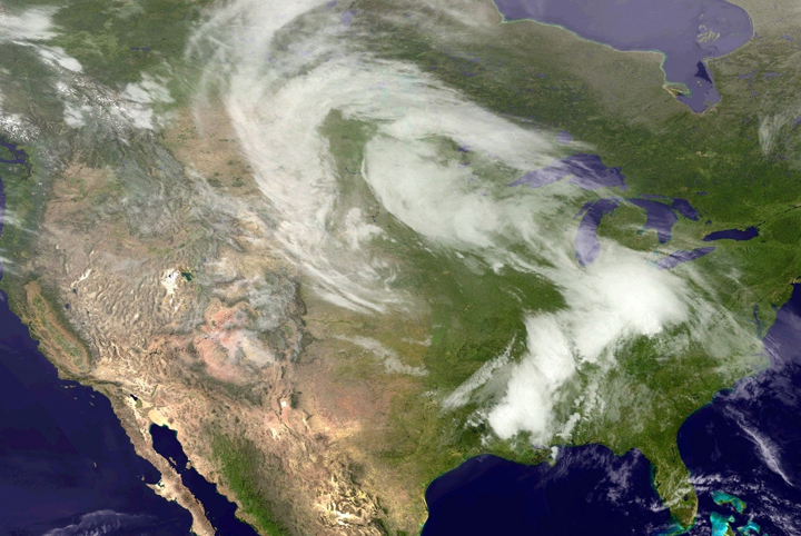 In this handout provided by the National Oceanic and Atmospheric Administration (NOAA) from the GOES-East satellite, a weather system travels over the continental United States that produced at least 31 tornadoes through the Plains and South pictured at 17:45 UTC. 