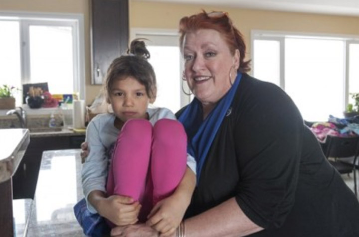Renn, and her mother is Fran Forsberg pose for a photograph at their acreage just outside of Saskatoon, Tuesday, April 1, 2014. Renn Forsberg's family says that, in her heart and in her brain, their six-year-old is a girl. They want her birth certificate to reflect that. Better yet, they argue, the sex box now marked with an 'M' should be removed from the document altogether.
