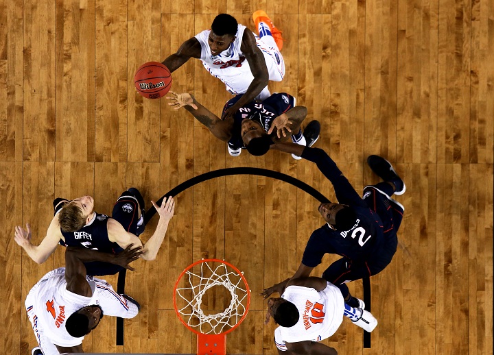 Casey Prather #24 of the Florida Gators goes up for a shot as DeAndre Daniels #2 of the Connecticut Huskies defends during the NCAA Men's Final Four Semifinal at AT&T Stadium on April 5, 2014 in Arlington, Texas.